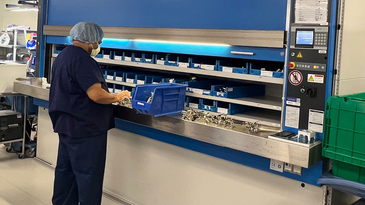 technician-sorting-sterile-instruments-in-automated-storage